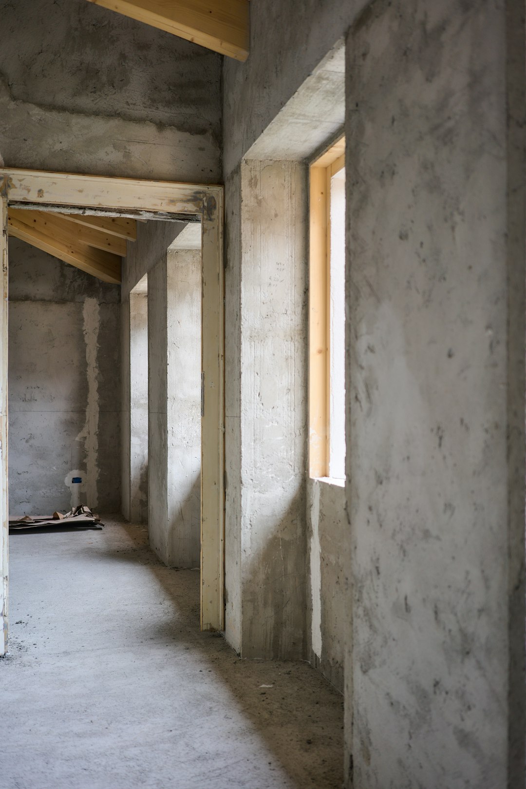 gallery-2 a-room-that-is-under-construction-with-concrete-walls-pbzbbcqyw8m